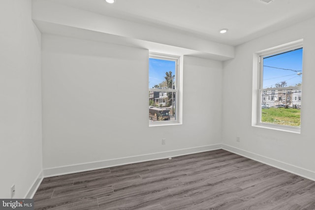 spare room featuring dark hardwood / wood-style floors