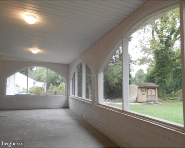 unfurnished sunroom with a healthy amount of sunlight