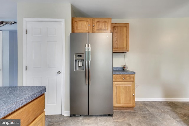 kitchen with stainless steel refrigerator with ice dispenser