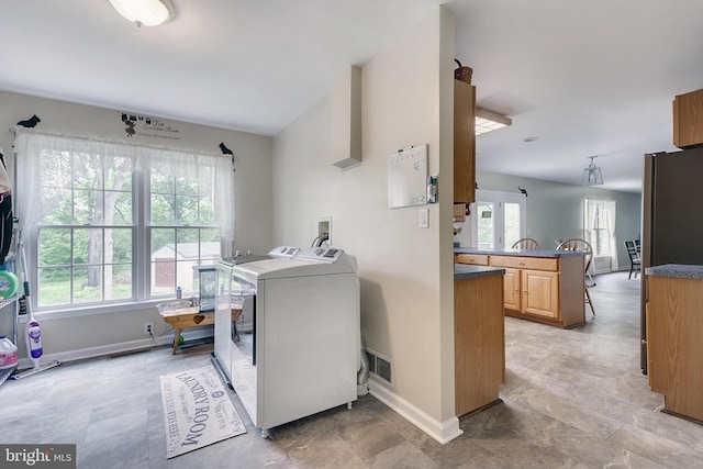 laundry area with washing machine and dryer