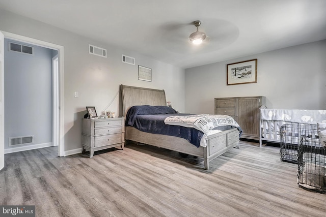 bedroom featuring light hardwood / wood-style floors and ceiling fan