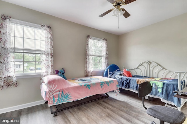 bedroom featuring wood-type flooring and ceiling fan