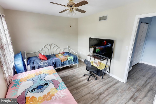 bedroom featuring hardwood / wood-style flooring and ceiling fan