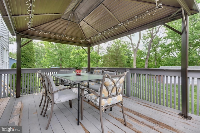 wooden terrace featuring a gazebo