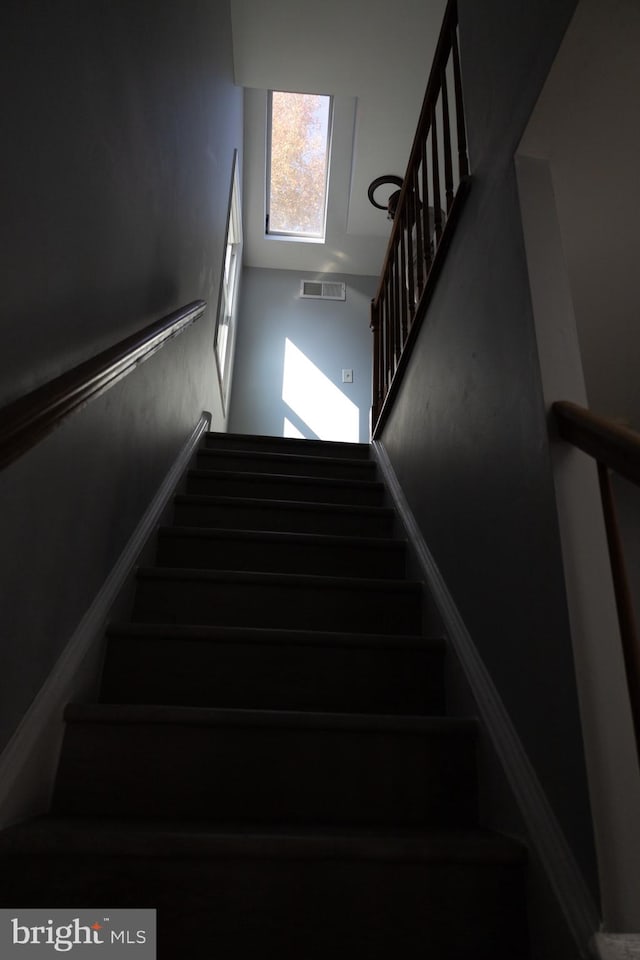 stairway with a high ceiling