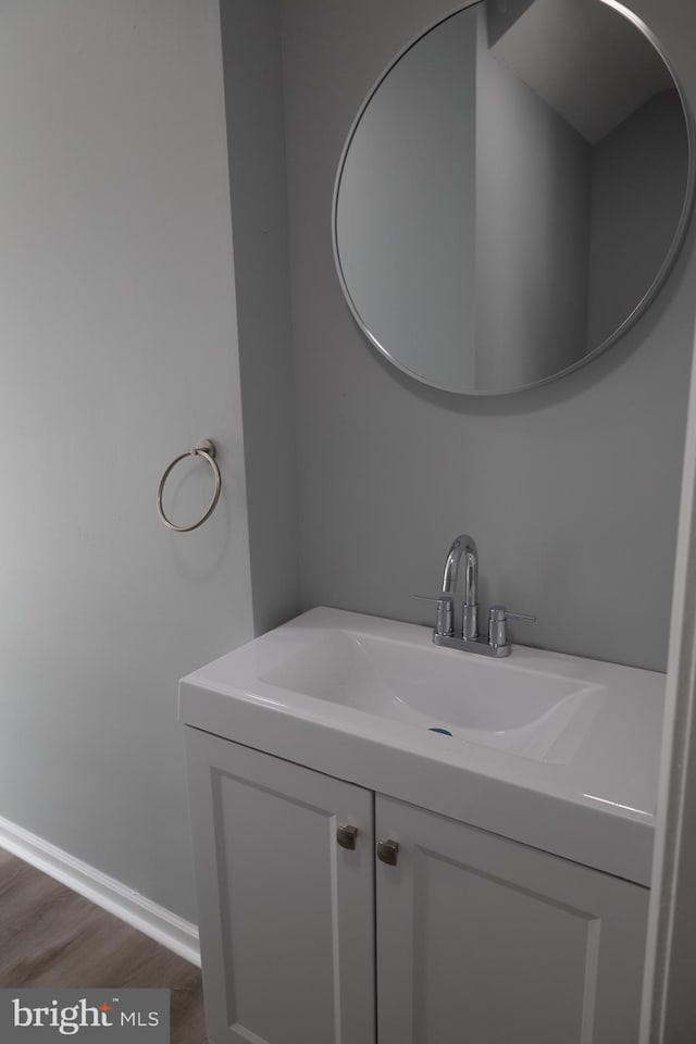 bathroom with wood-type flooring and vanity