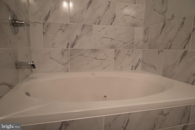 bathroom featuring tiled bath