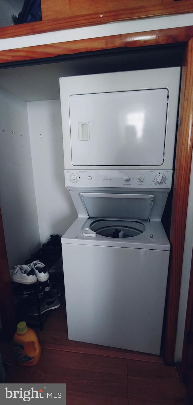 laundry room featuring stacked washer and dryer