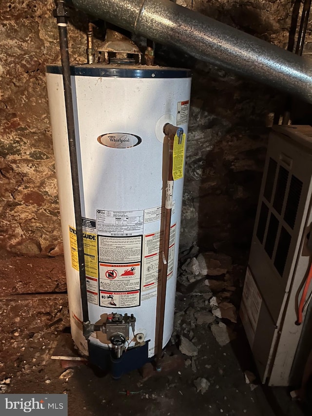 utility room featuring gas water heater