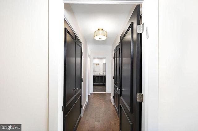 corridor featuring dark wood-type flooring