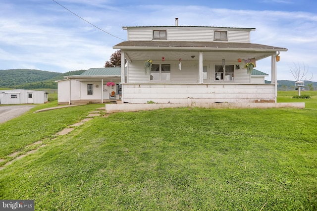 view of front of property with a front lawn and covered porch