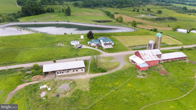 birds eye view of property featuring a rural view and a water view