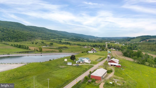 birds eye view of property featuring a rural view and a water view