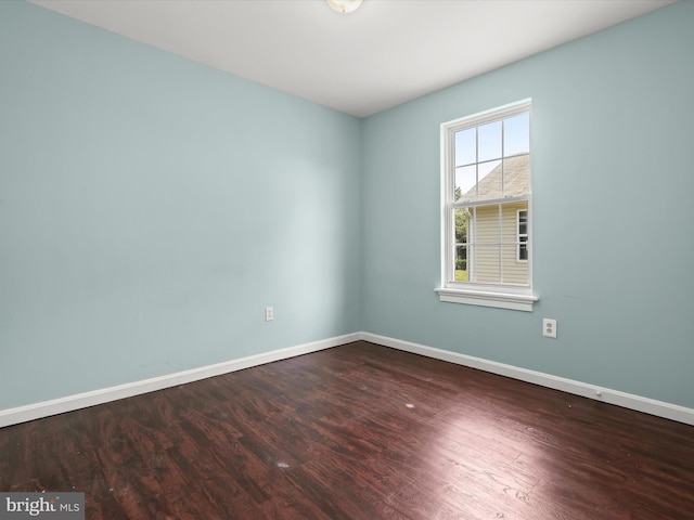 unfurnished room with hardwood / wood-style floors