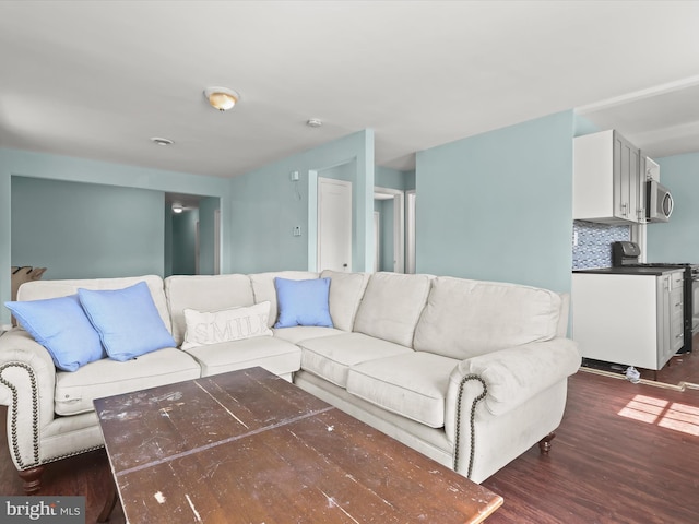 living room with dark hardwood / wood-style floors