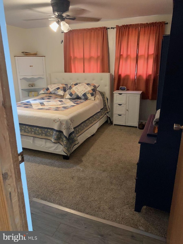 bedroom with ceiling fan and carpet flooring