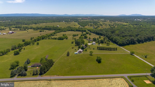 drone / aerial view featuring a rural view and a mountain view