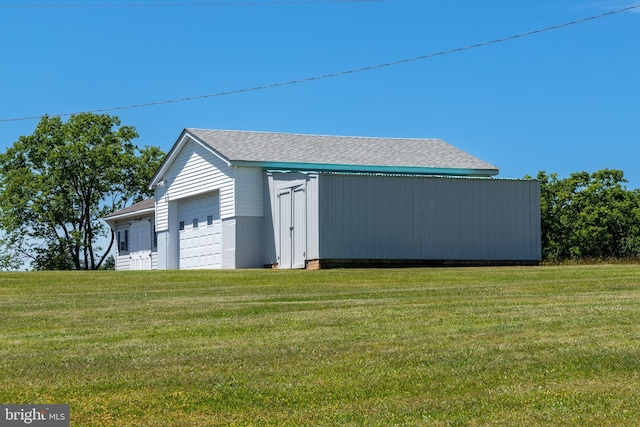 garage with a lawn