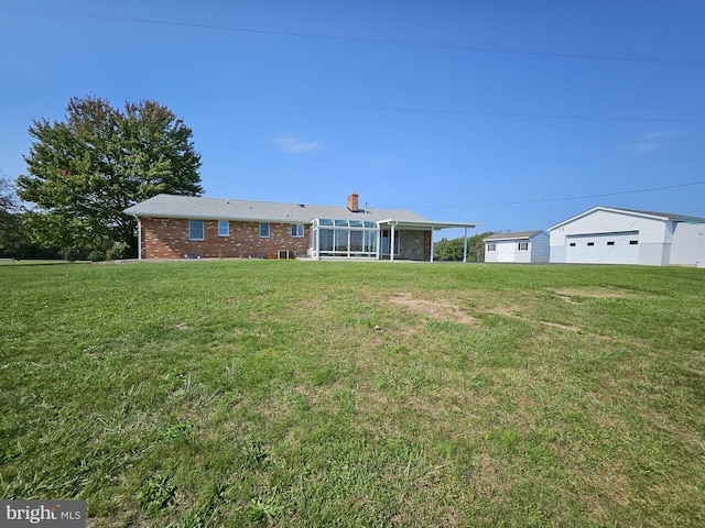 exterior space featuring a sunroom and a front lawn