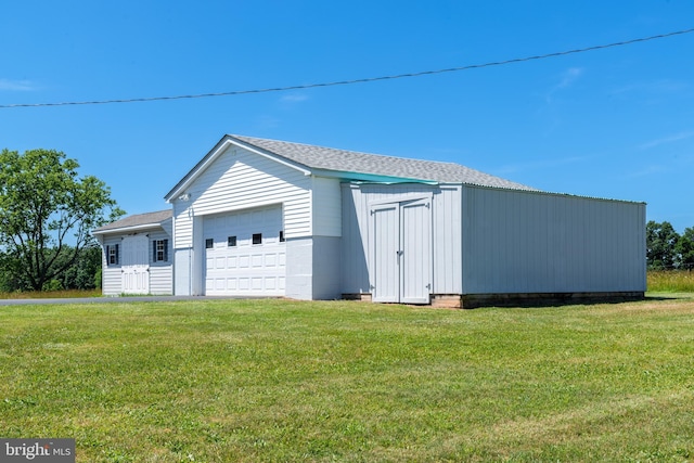 garage with a lawn