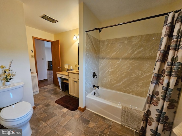 full bathroom featuring shower / tub combo, vanity, and toilet