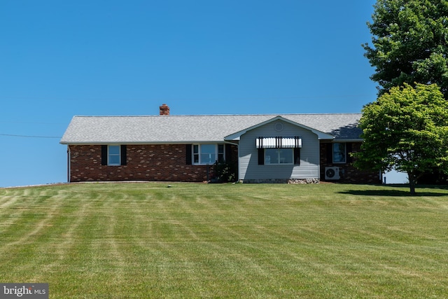 ranch-style home featuring a front yard