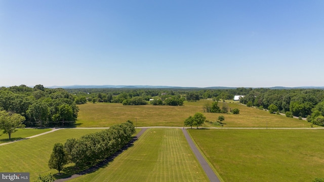 birds eye view of property with a rural view