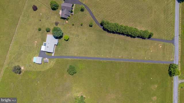 birds eye view of property with a rural view