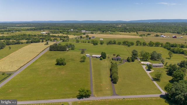 birds eye view of property with a rural view