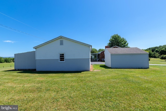 view of side of home featuring a lawn