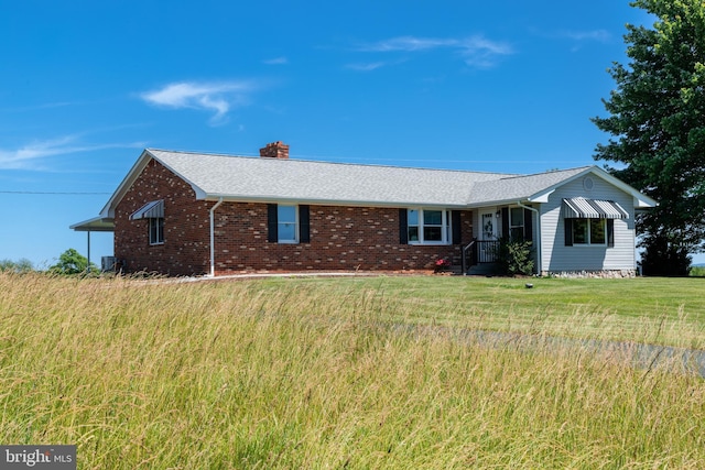 ranch-style home with a front lawn