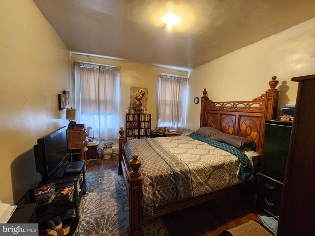 bedroom with hardwood / wood-style floors