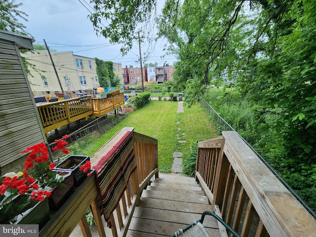 wooden deck with a yard