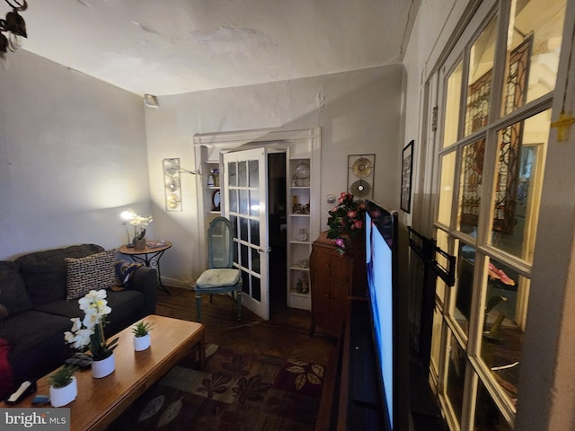 living room featuring wood-type flooring and french doors