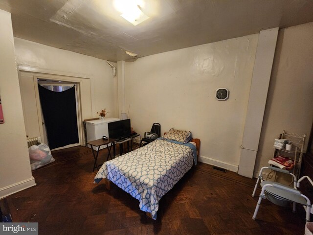 bedroom with parquet flooring