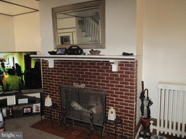 interior details with a brick fireplace