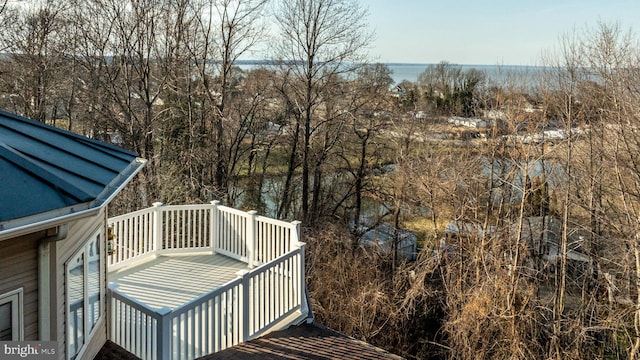 wooden deck with a water view