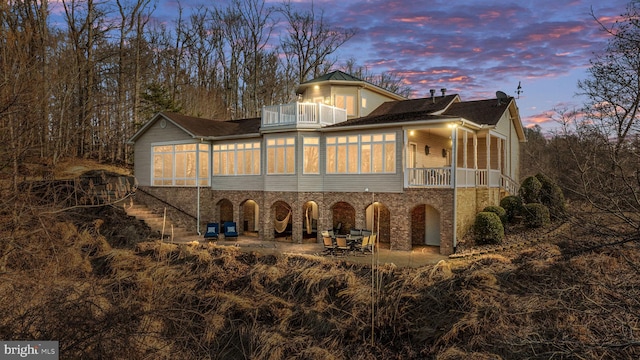 exterior space featuring a patio area and a balcony