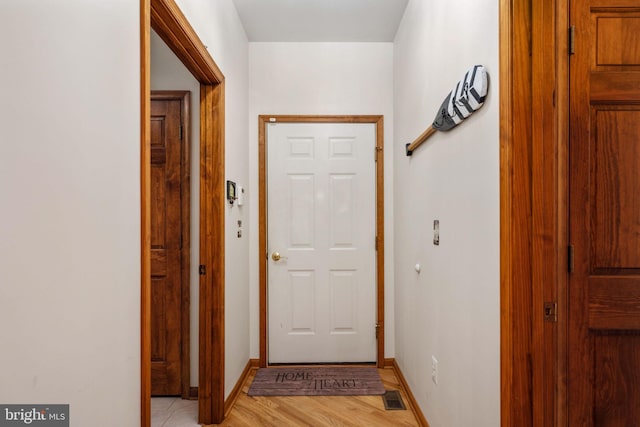 entryway with light hardwood / wood-style flooring