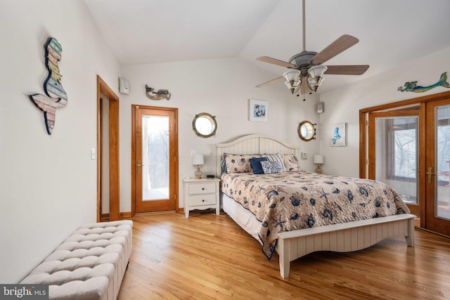 bedroom with ceiling fan, french doors, hardwood / wood-style floors, access to outside, and lofted ceiling