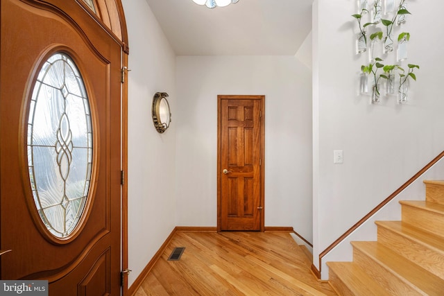 entrance foyer with light hardwood / wood-style flooring