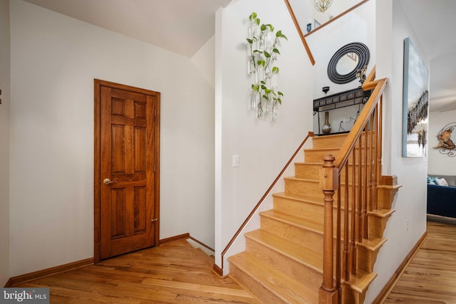 staircase featuring hardwood / wood-style floors