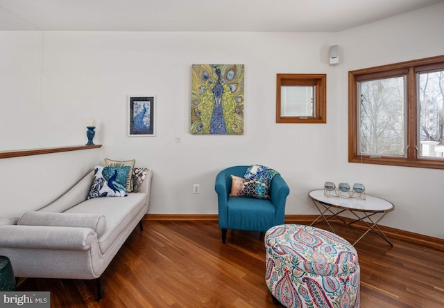 living area with hardwood / wood-style flooring