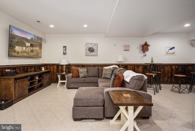 tiled living room featuring bar