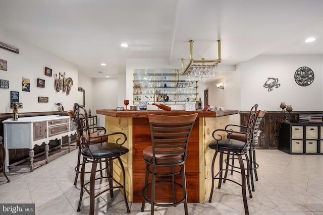 bar featuring light tile floors