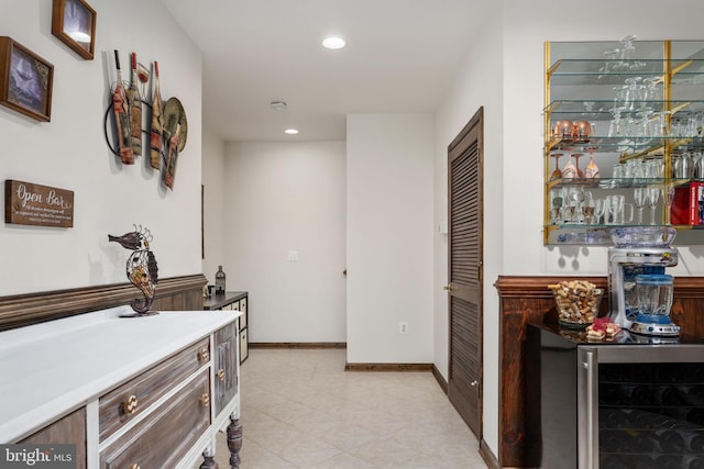 interior space featuring wine cooler and light tile floors