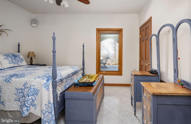 bedroom with ceiling fan and light tile floors