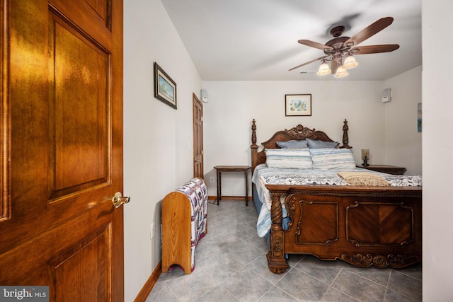 bedroom featuring tile flooring and ceiling fan