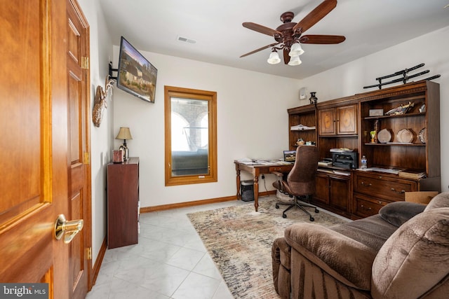 home office featuring ceiling fan and light tile floors