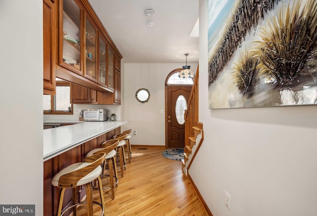 interior space featuring plenty of natural light and light hardwood / wood-style floors